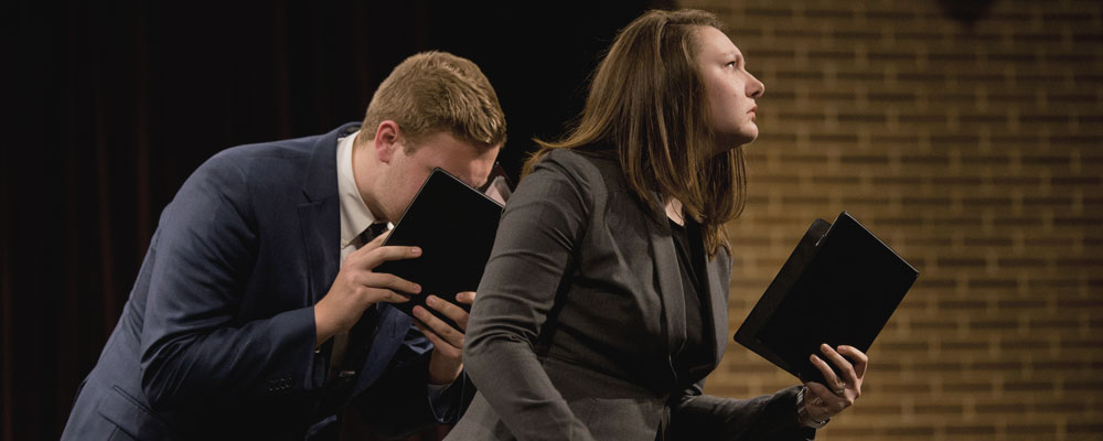 Two Speech students performing at Reader's Theatre.